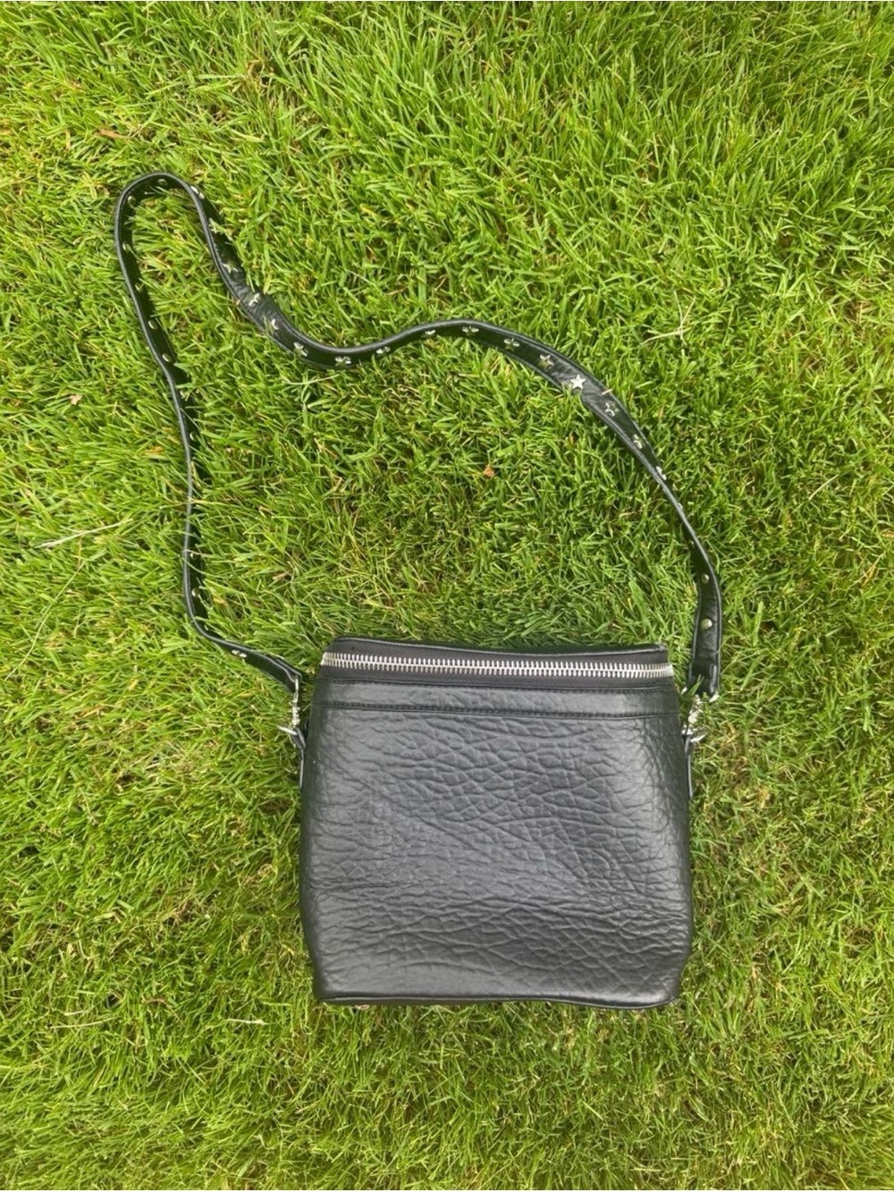 Black crossbody bag with silver star studding!